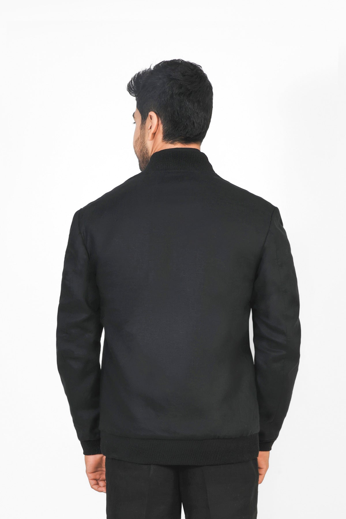 Man wearing a black jacket on a white background