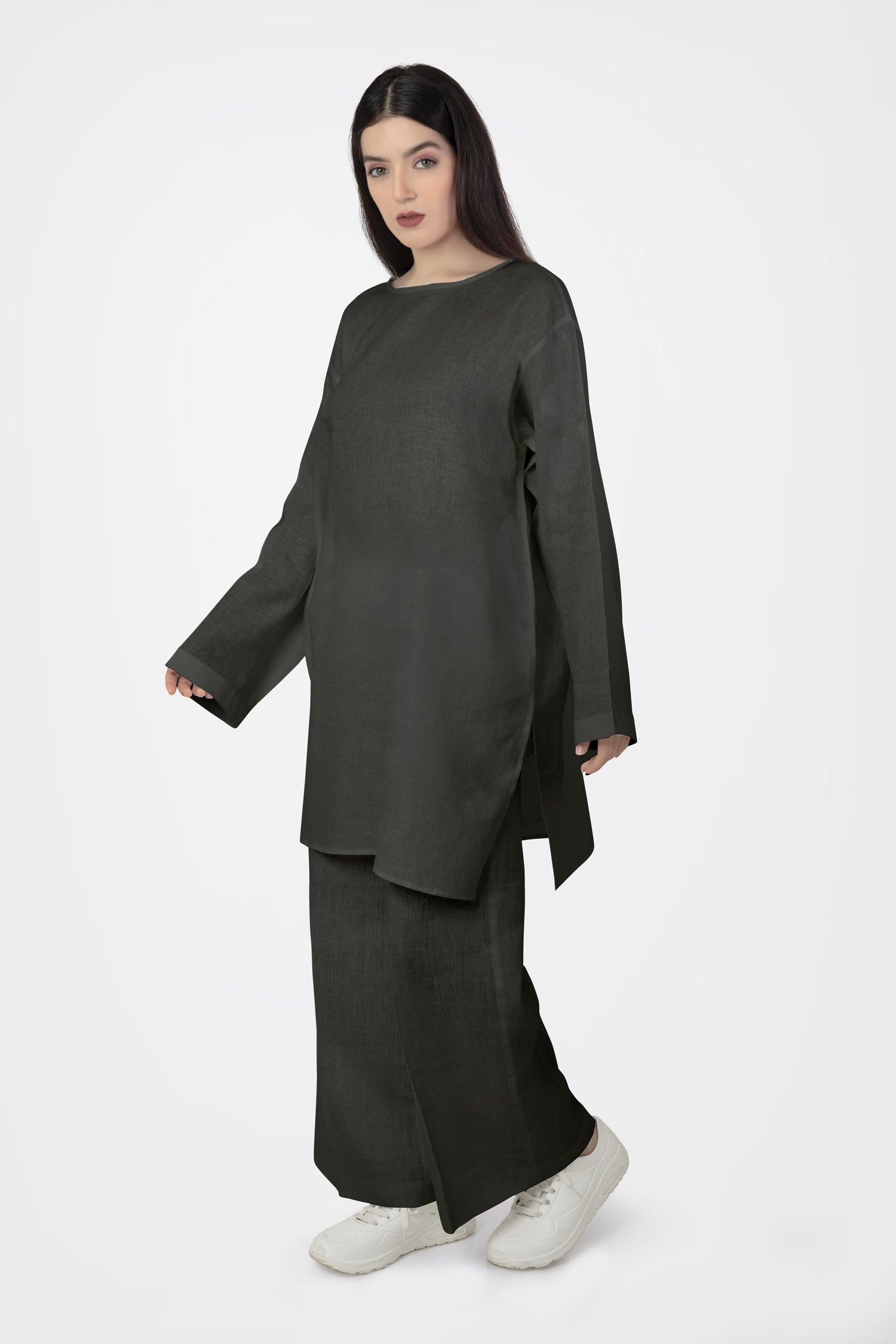 Women wearing white long top with long sleeves near beach
