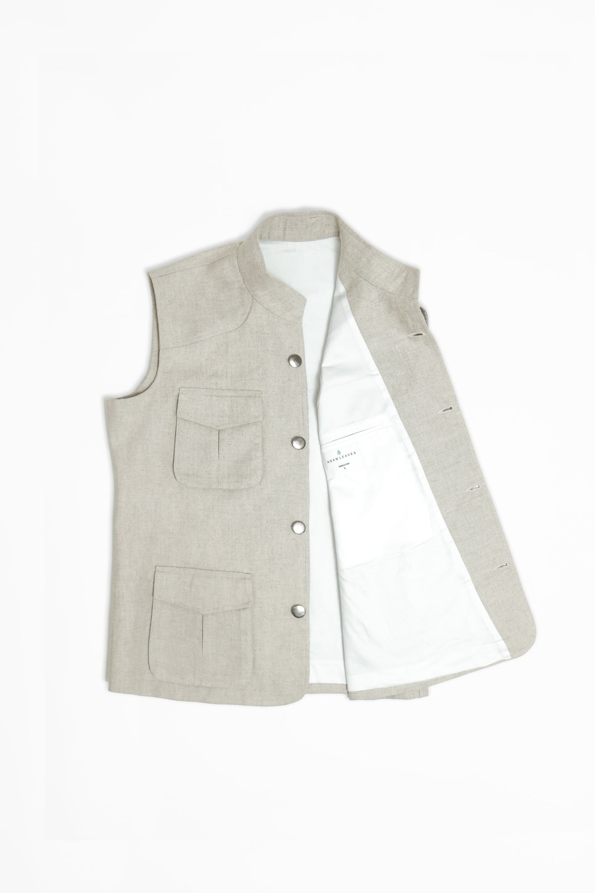 Light gray vest with button details on a white background