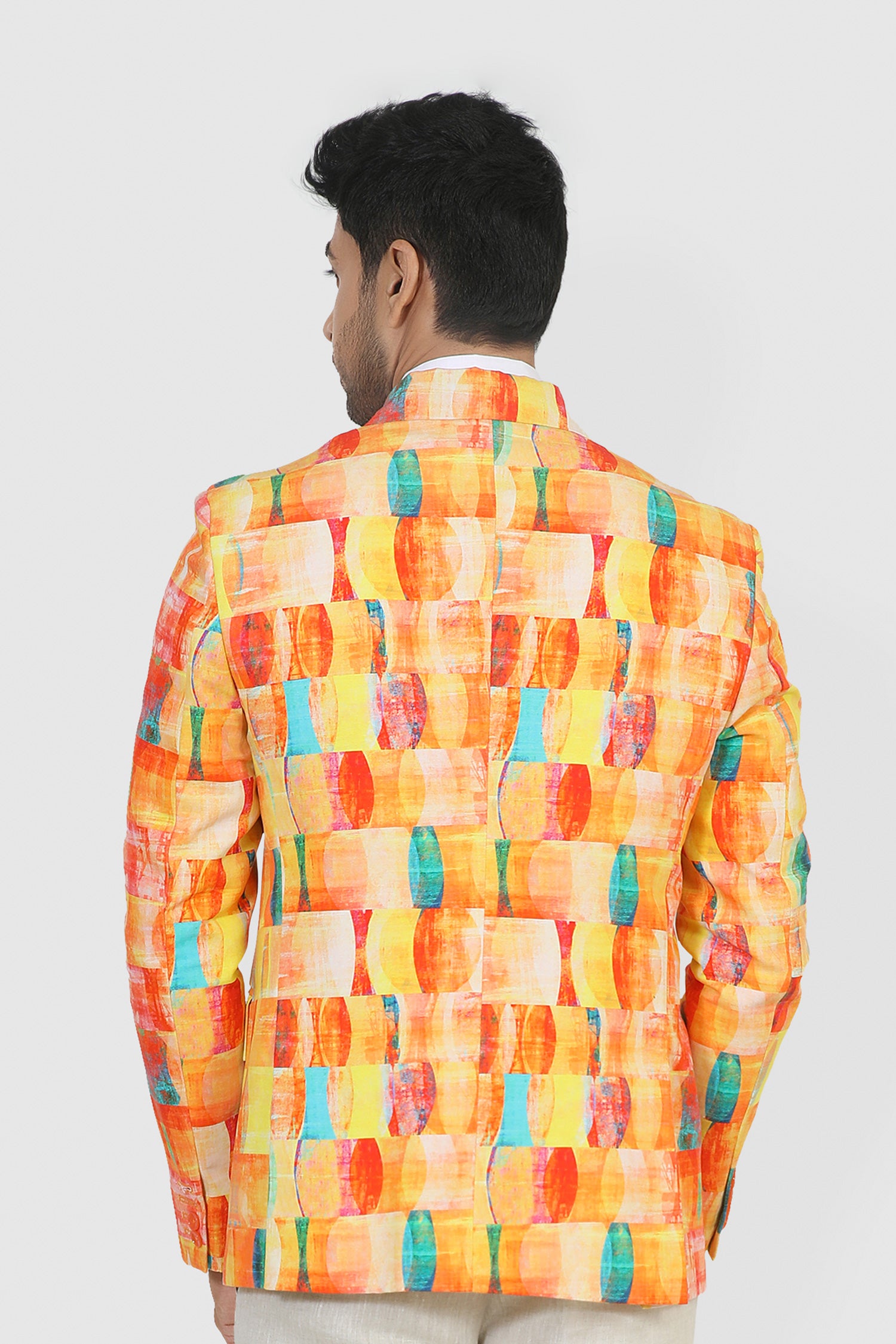 Man wearing a colorful checkered shirt on a white background