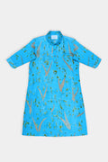 A bright blue short-sleeve shirt dress with a subtle abstract pattern of gold and green, laid flat against a light gray background.