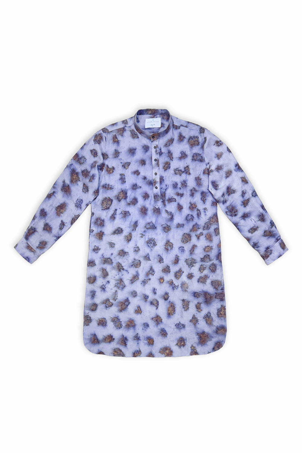 A man modeling a light purple/lavender long-sleeve kurta with a brown and purple floral pattern, paired with white trousers and white sneakers, against a plain white studio background.