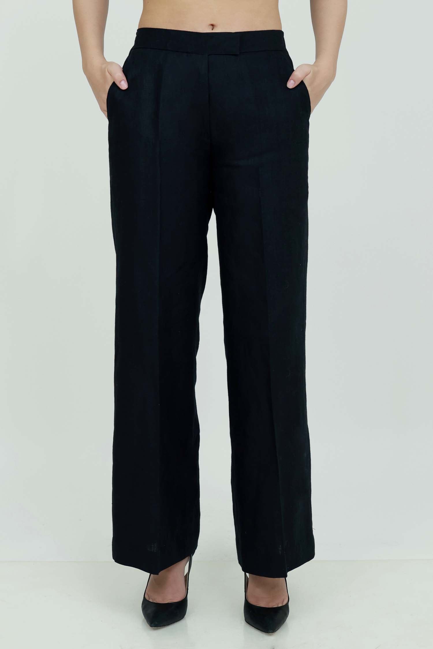 A pair of black wide-leg trousers with a mid-rise waist, front buttons, and a relaxed fit. The trousers are fully lined and have a hook and bar closure at the waistband with an adjustable elastic belt.