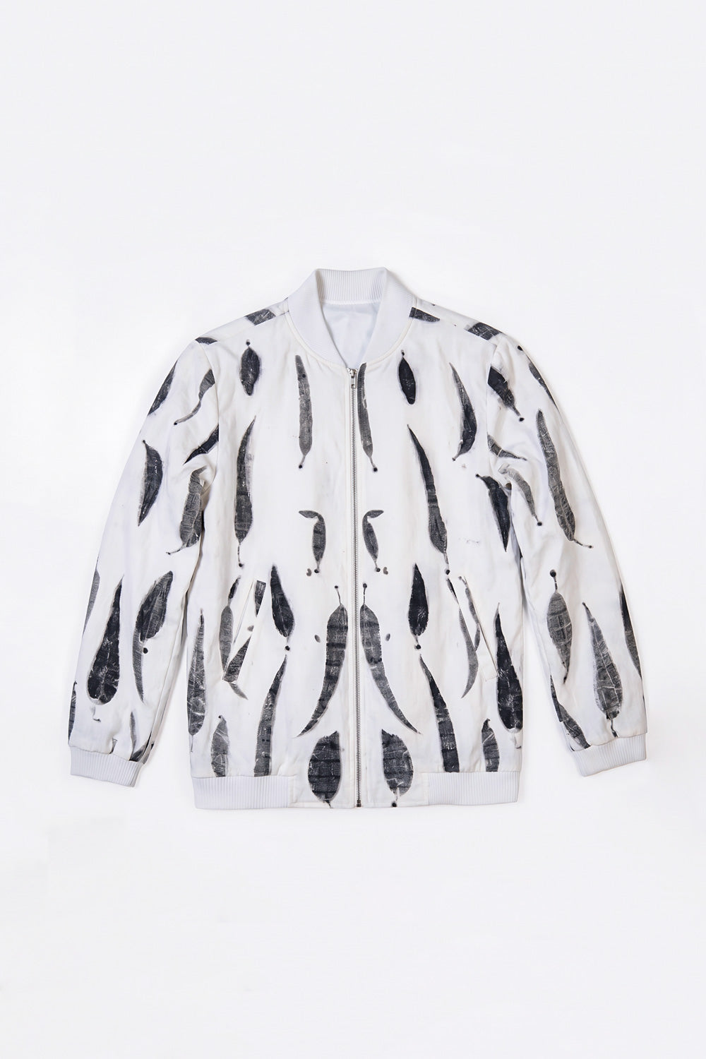 A white zip-up hemp bomber jacket featuring a black eco-print, displayed flat against a plain white background.