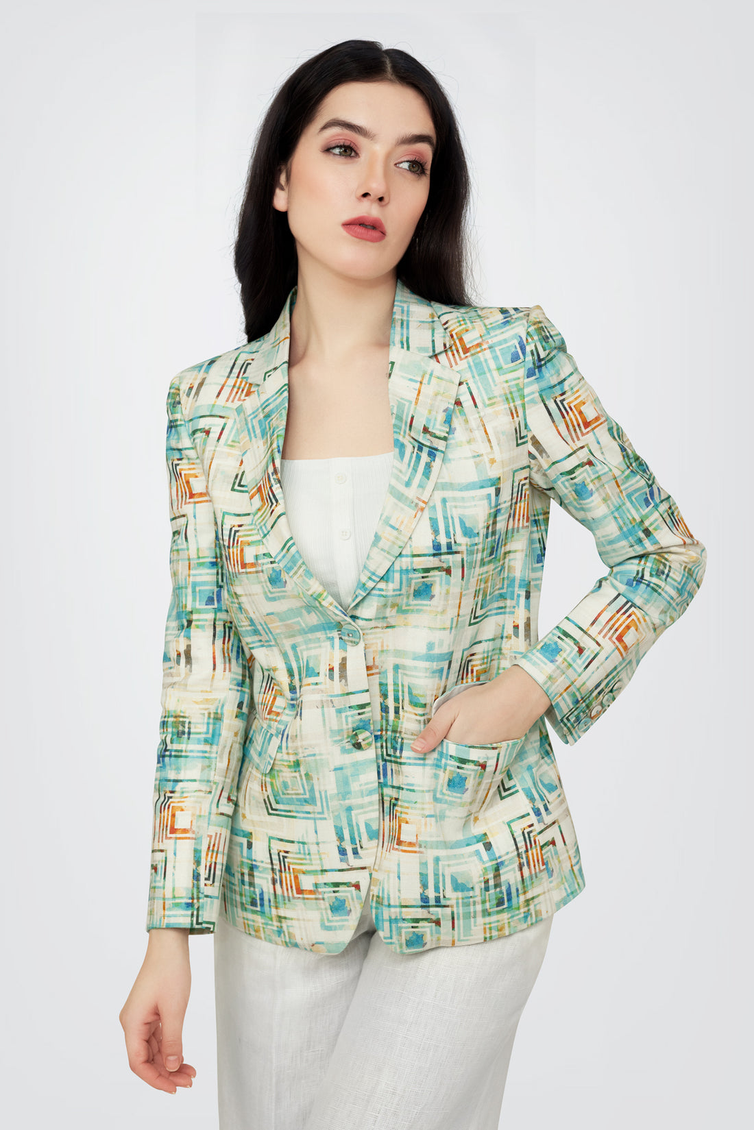 Woman wearing a patterned blazer on a white background
