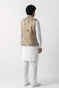 A man shown from the back wearing a white traditional outfit with a beige eco-printed hemp vest, photographed against a plain white studio background.