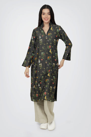 A woman standing against a white background, wearing a floral print long sleeve kurta with a mandarin collar and a V-shaped neck.