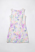 A sleeveless A-line hemp dress with a pastel multicolor geometric print, laid flat against a light gray background.