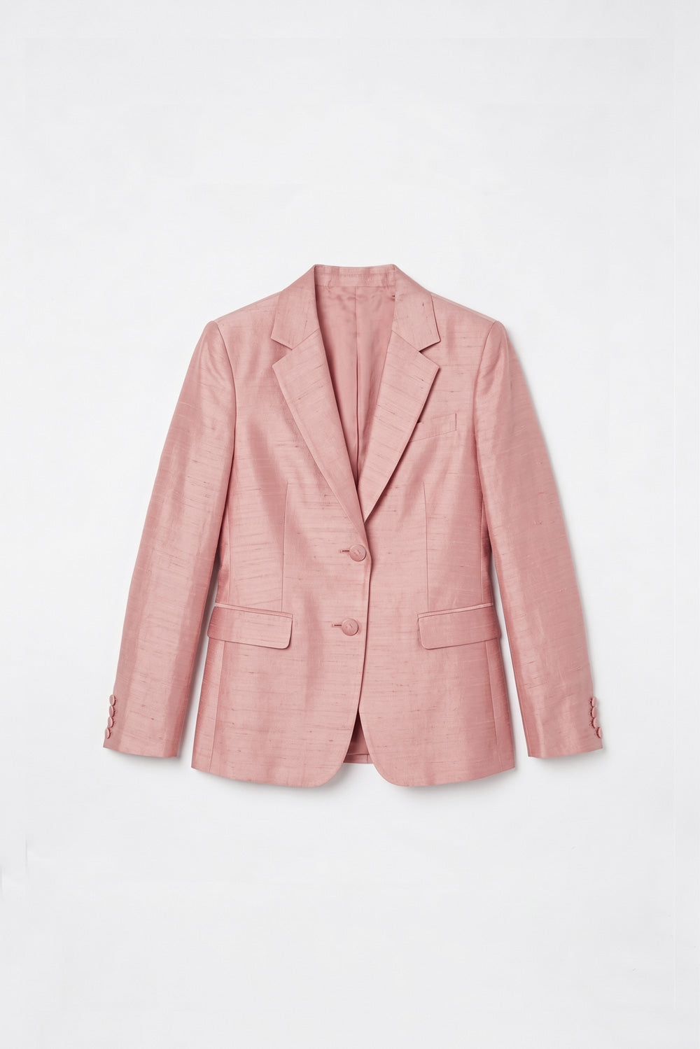 A light pink textured silk blazer with notch lapels, a two-button front closure, and flap pockets, displayed flat against a clean white background.
