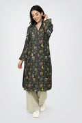 A woman standing against a white background, wearing a floral print long sleeve kurta with a mandarin collar and a V-shaped neck.