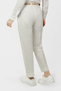 A pair of white women's hemp trousers with a belt, slanting front pockets, and jetted back pockets, featuring a hook and bar closure at the waistband and a zip fly.