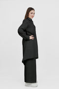 Woman wearing a black outfit on a white background