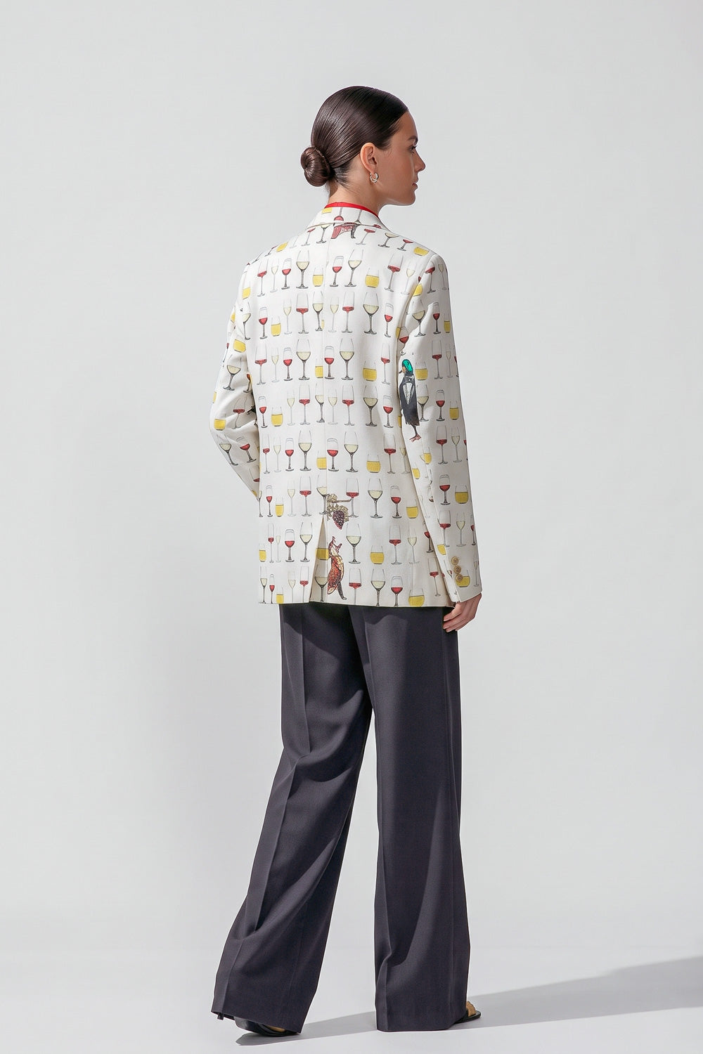 Back view of the Jam women's hemp boyfriend blazer with its all-over printed design and back vents