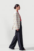 Side view of the oversized Jam hemp boyfriend blazer showing its relaxed length and drape