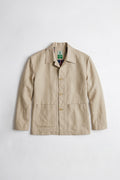 A beige linen utility linen jacket with a button-up front, collar, and two front pockets, laid flat against a light gray background.