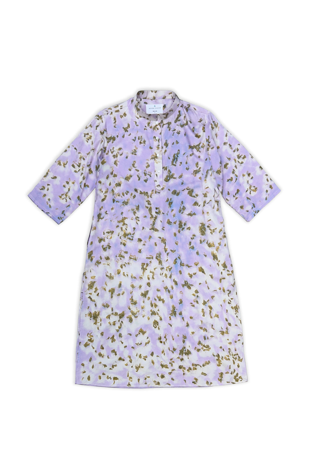 A short-sleeved tunic dress with a lavender and white watercolor wash, decorated with an all-over olive green and gold floral print, shown flat on a white background.