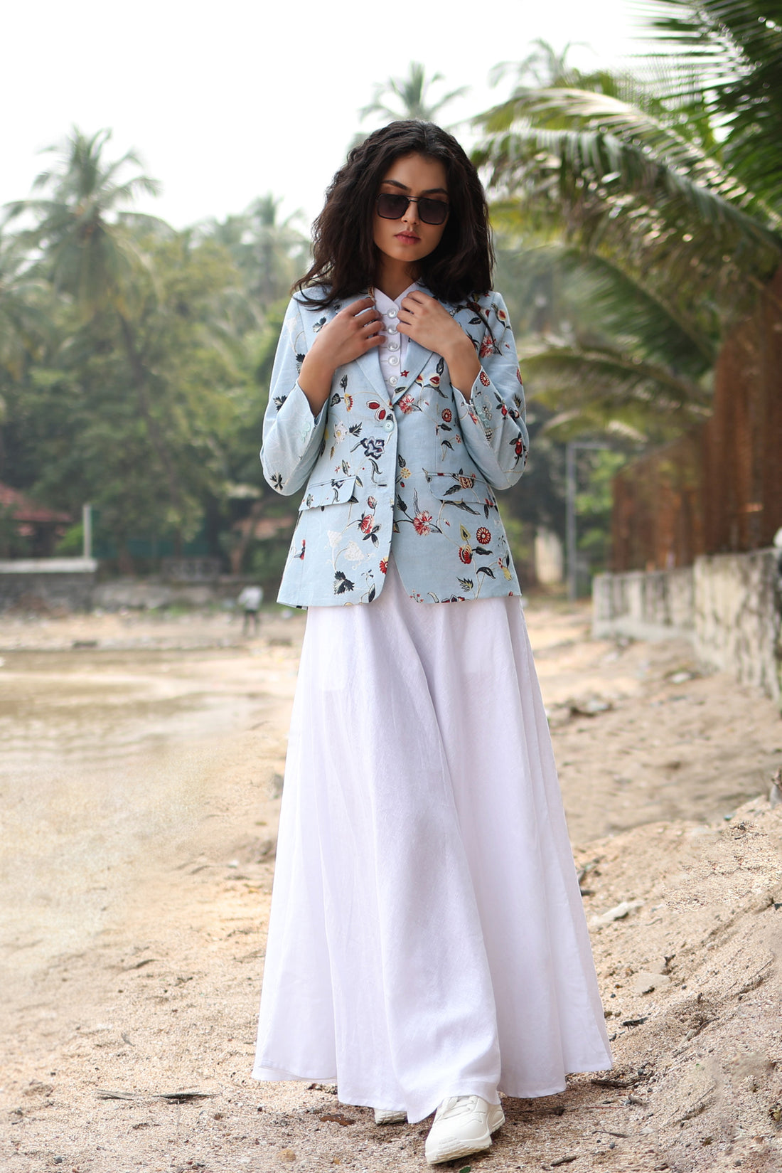 Women wearing patterned blazer with flaired skirt
