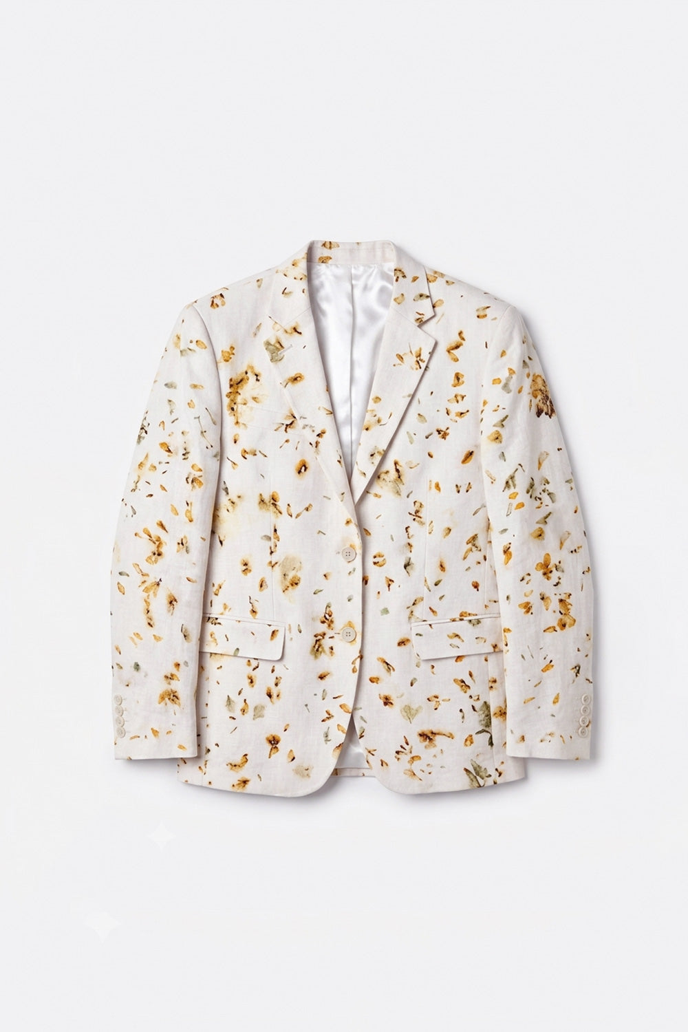 A men's single-breasted hemp blazer in a warm off-white or cream fabric, eco-printed with a scattered pattern of dried golden-brown flower petals, shown against a plain light gray background.