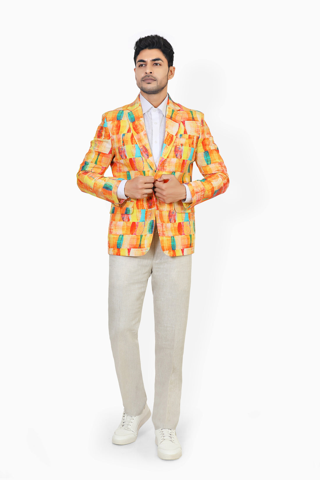 Man wearing a colorful checkered suit on a white background