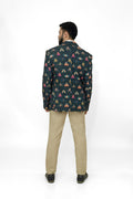 Man wearing a butterfly printed blazer on a white background