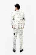 Man wearing a white suit with colorful cocktail-themed pattern on a white background