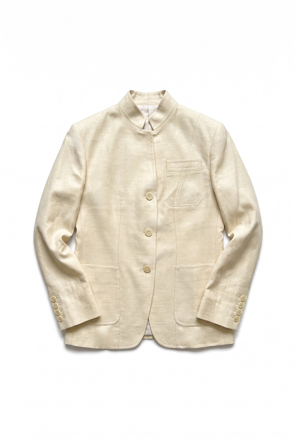 Assam women's Muga silk jacket in natural gold with mandarin collar, three buttons and patch pockets, flat lay