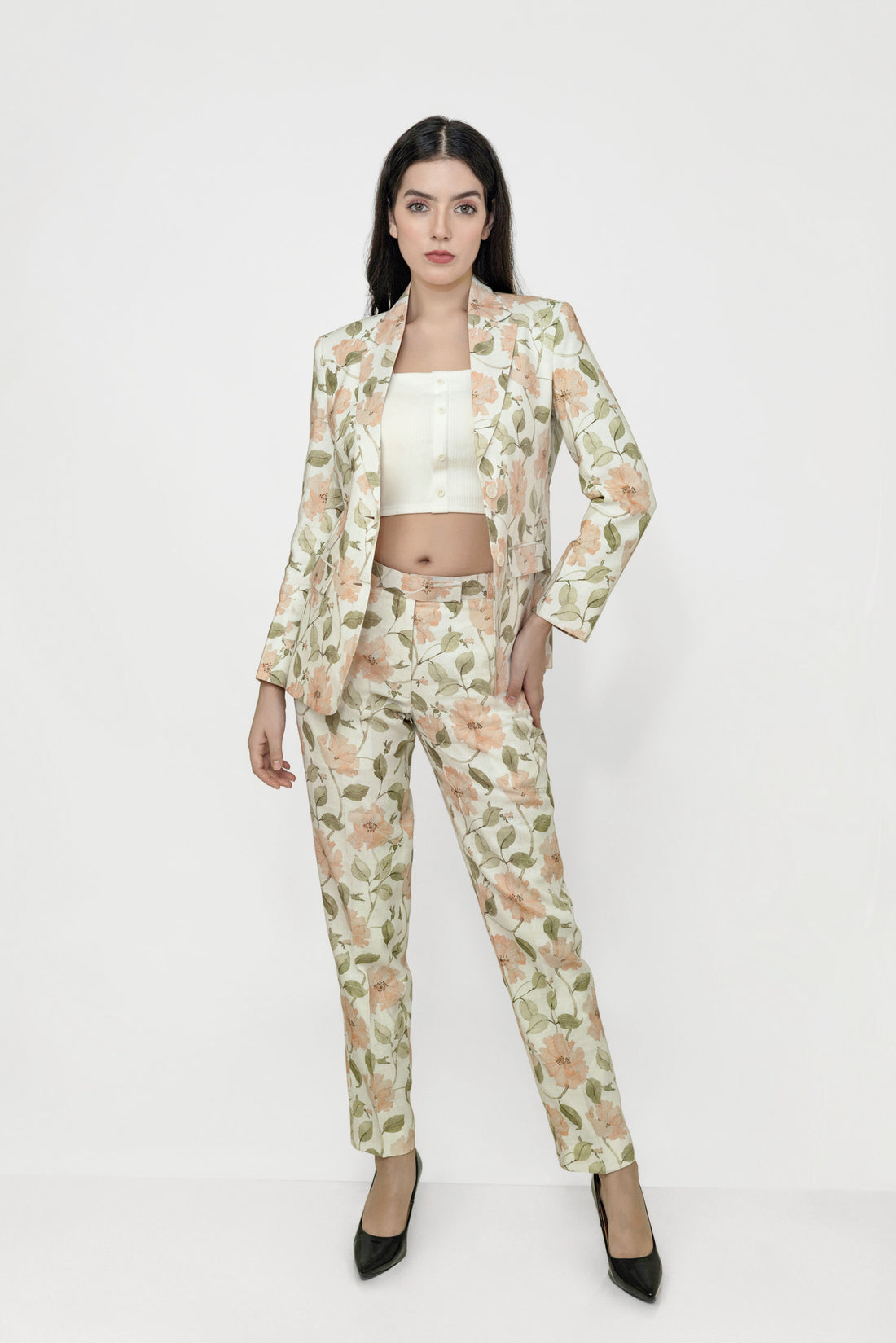 Woman wearing a floral suit on a white background