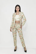 Woman wearing a floral suit on a white background