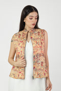 Woman wearing a patterned vest on a white background