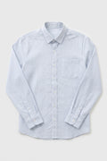 A long-sleeve button-up linen shirt with a fine blue and white vertical stripe pattern, featuring a classic collar, chest pocket, and buttoned cuffs, laid flat against a light gray background.