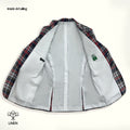 A red, blue, and white checkered linen blazer with notch lapel, two-button front, flap pockets, and a chest pocket. 