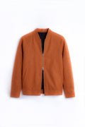 A rust-orange zip-up Linen jacket with a stand collar, laid flat against a clean white background.