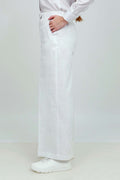 A pair of white wide-leg trousers with a mid-rise waist, front buttons, and a relaxed fit. The trousers are fully lined and have a hook and bar closure at the waistband with an adjustable elastic belt.