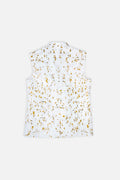 A sleeveless white collared shirt with a gold and black speckled pattern, displayed flat against a light gray background.
