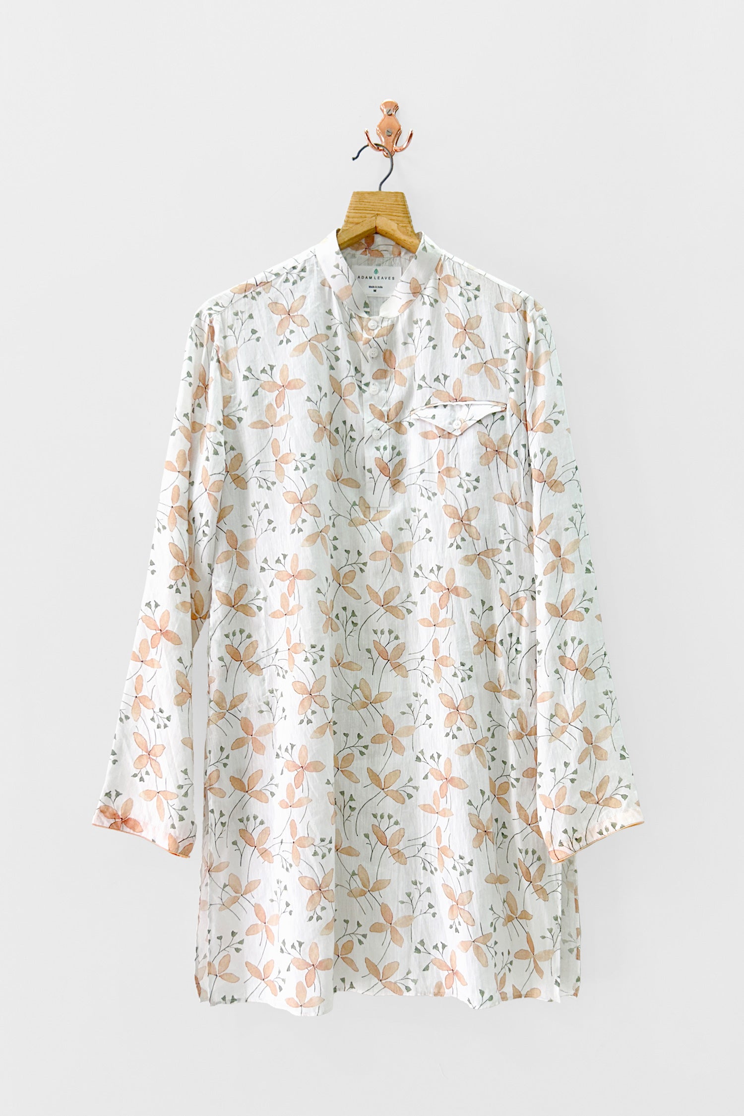 Indian ethnic white printed kurta hanging