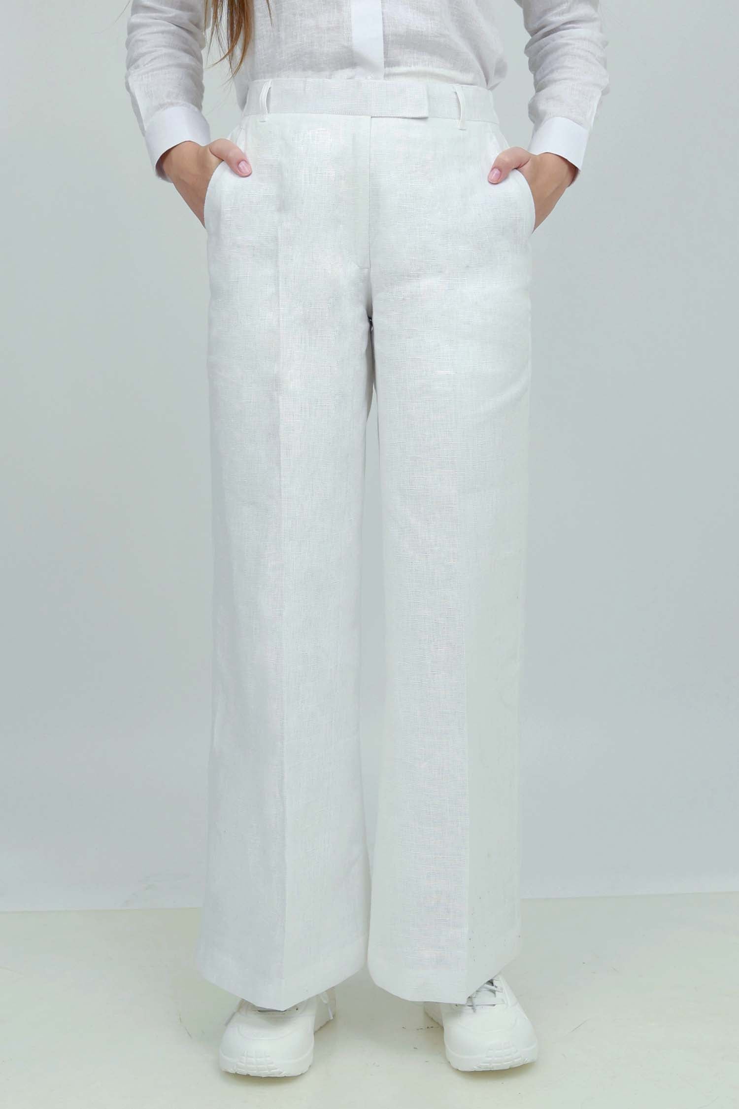 A pair of black wide-leg trousers with a mid-rise waist, front buttons, and a relaxed fit. The trousers are fully lined and have a hook and bar closure at the waistband with an adjustable elastic belt.