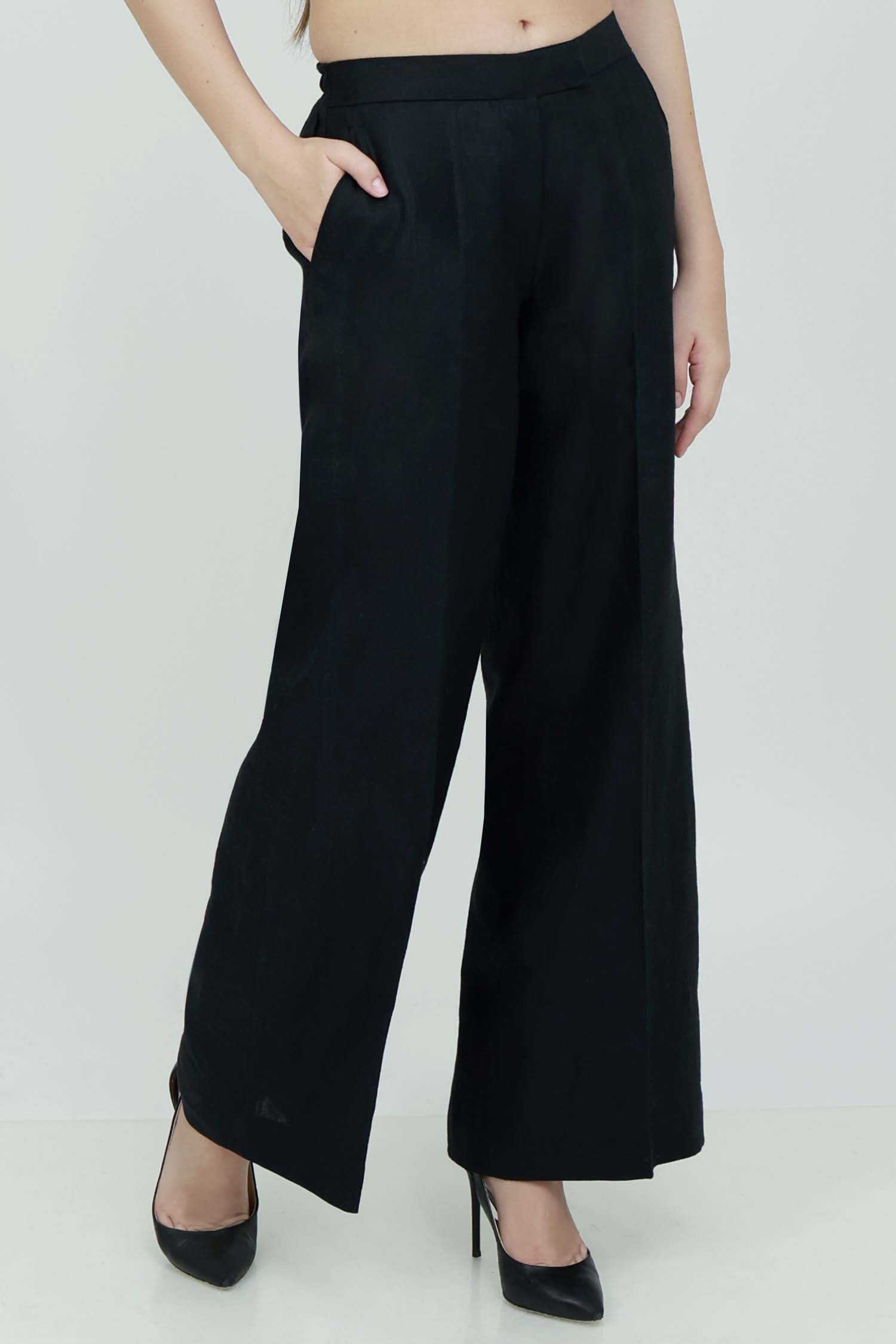 A pair of black wide-leg trousers with front button opening, 5 belt loops, 2 slanted front pockets, 2 jetted back pockets, and an elastic waistband.