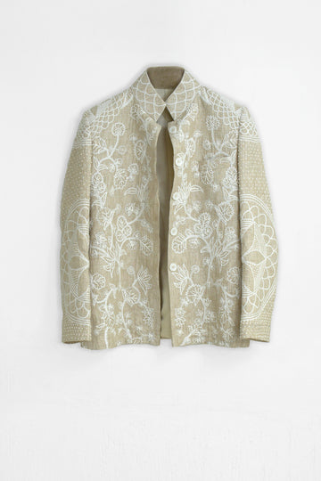 Beige floral-patterned coat on a white background