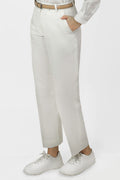 A pair of white women's hemp trousers with a belt, slanting front pockets, and jetted back pockets, featuring a hook and bar closure at the waistband and a zip fly.