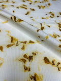 Bamboo-cotton seersucker fabric eco-printed with marigold petals, softly folded