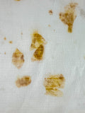 Close-up detail of onion skin eco-print on bamboo-cotton seersucker fabric