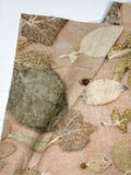 Beige hemp-cotton fabric hand eco-printed with leaves, softly folded