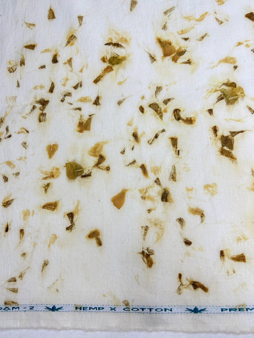 Hemp-cotton fabric hand eco-printed with marigold petals, full flat view