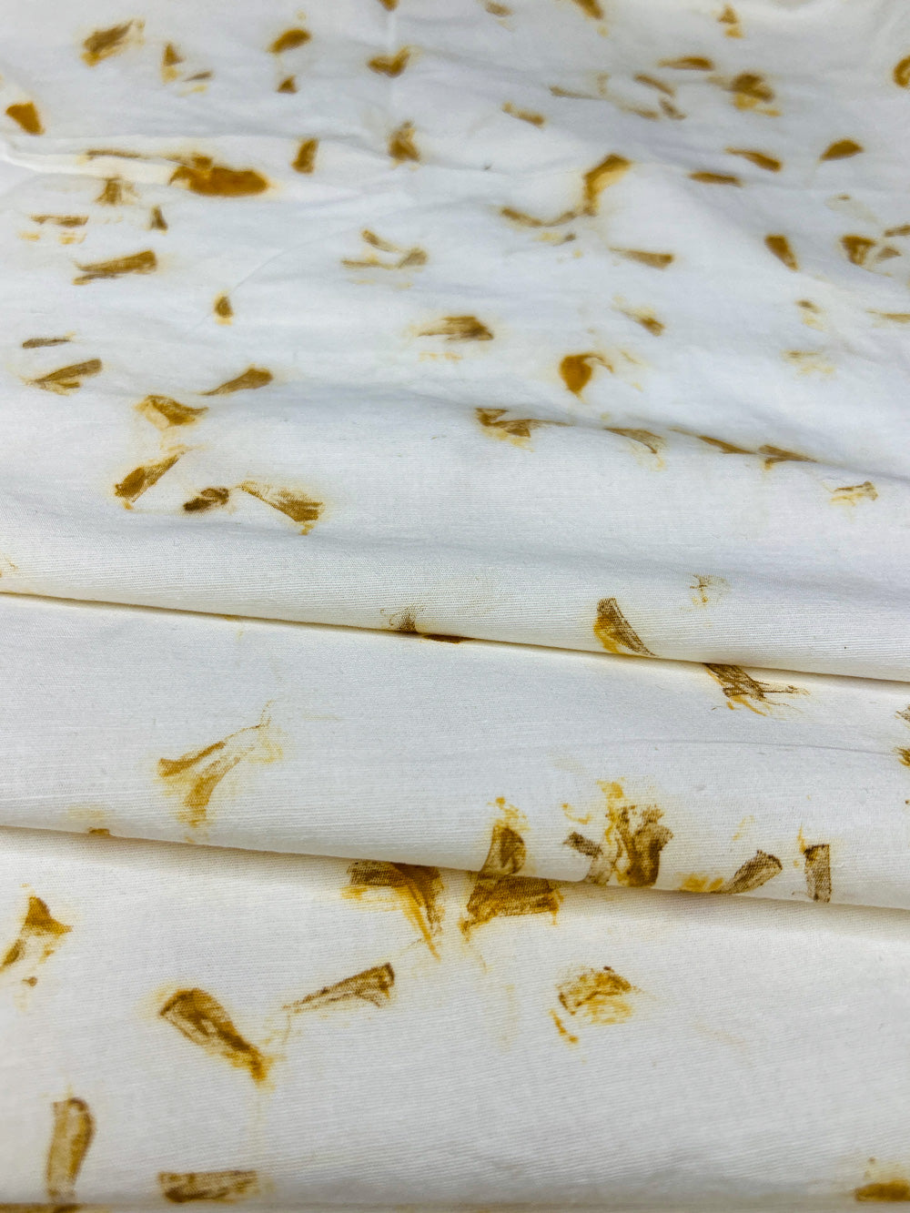 Hemp-cotton eco-printed fabric draped in soft folds