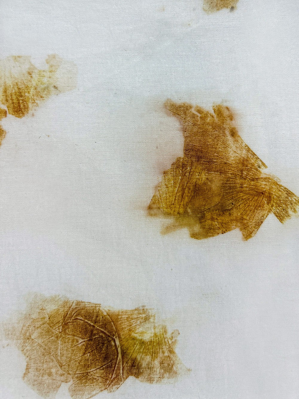 Close-up of onion skin eco-print on hemp-cotton fabric