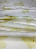 Linen fabric hand eco-printed with leaves, draped in soft folds