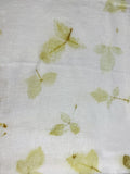 Linen fabric hand eco-printed with leaves, full spread showing repeated leaf prints