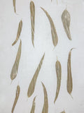 Ivory linen with eucalyptus leaf prints in soft gold-brown, flat view