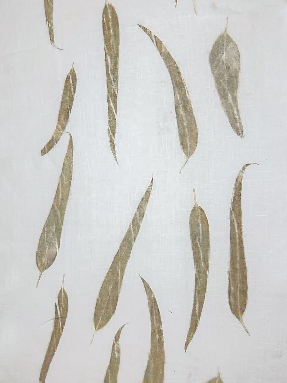 Ivory linen with eucalyptus leaf prints in soft gold-brown, flat view