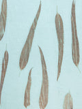 Sky blue linen hand eco-printed with eucalyptus leaves, close view of the print